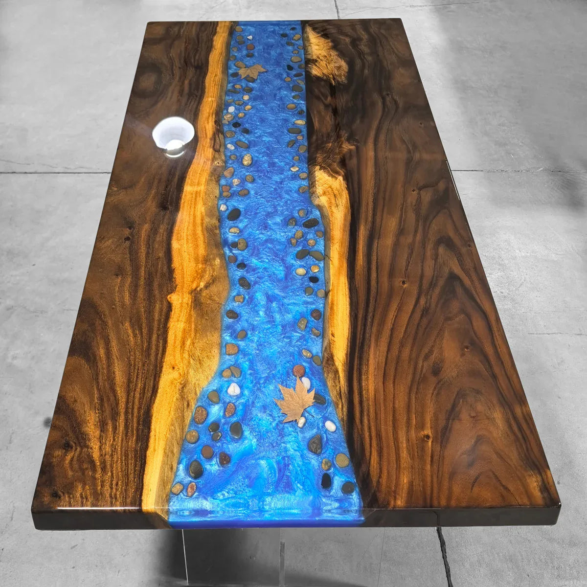 Dining table with blue resin river natural pebbles rocks leaf